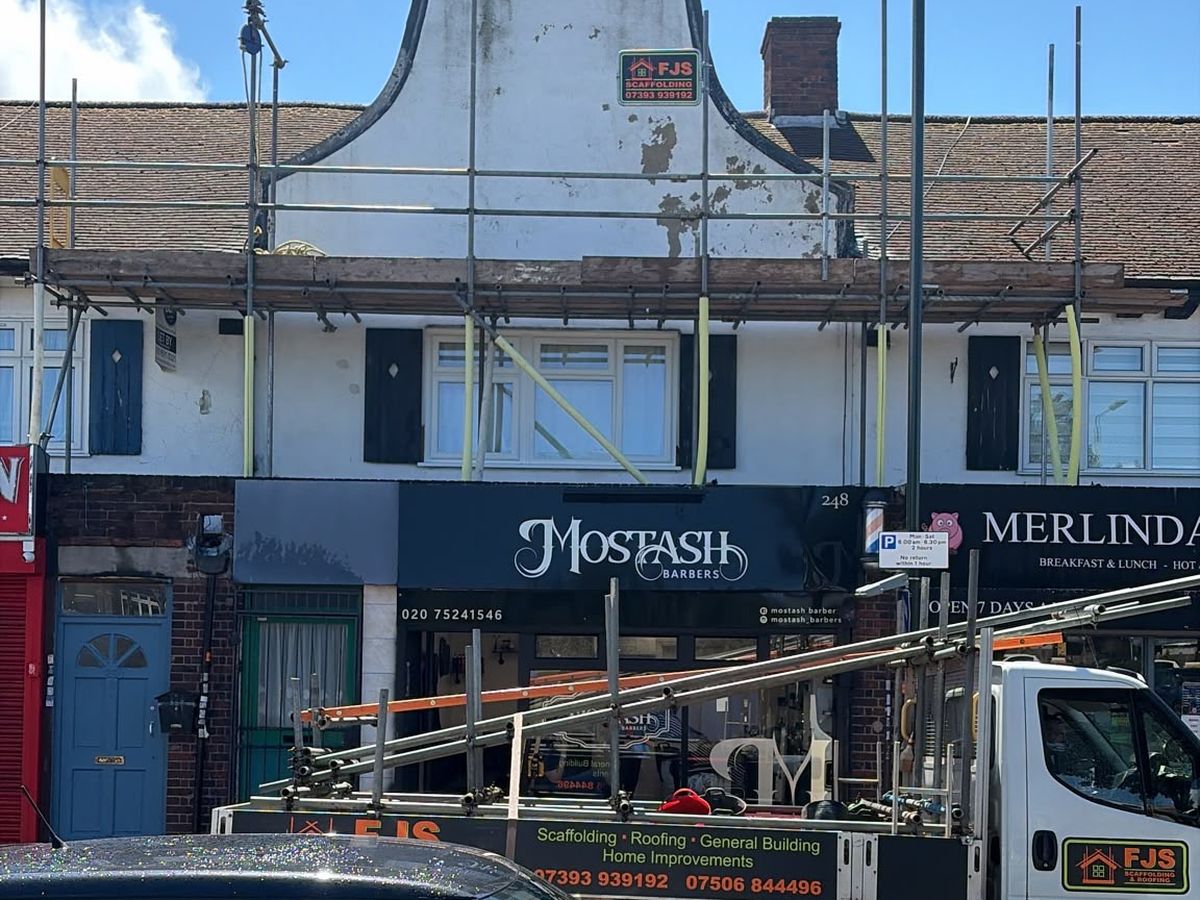 Scaffold above a shopfront with the FJS truck on site